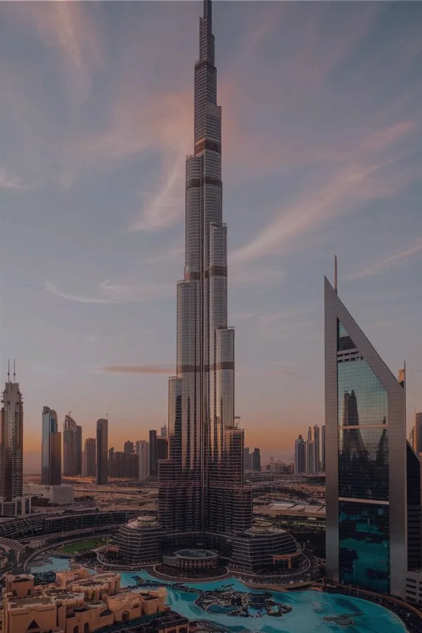 Dubai skyline with towers and highways at sunset